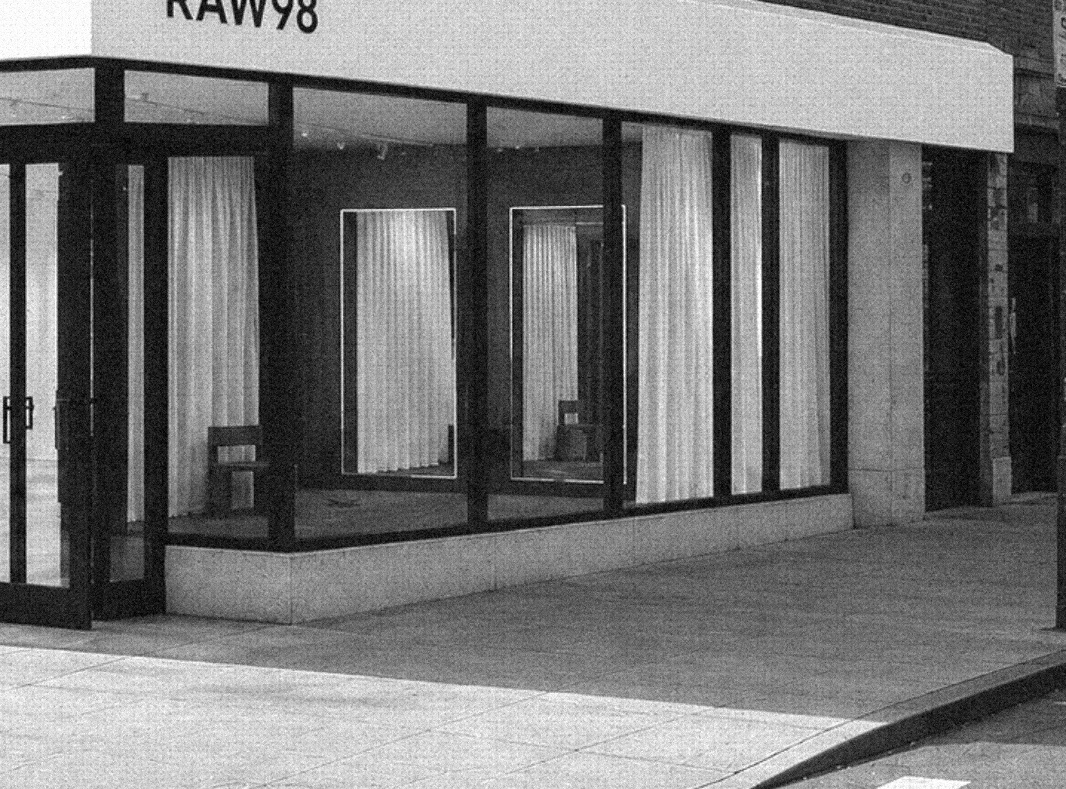 RAW98 storefront with cream awning and black steel windows